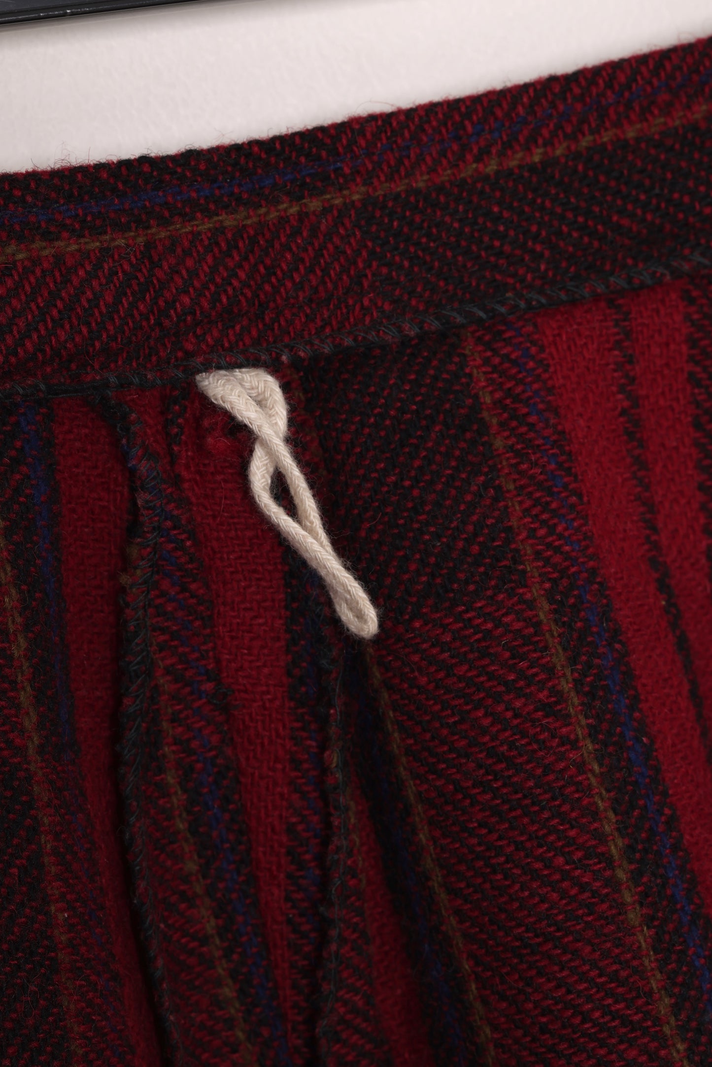 Circa 1975–1985, wool plaid day skirt, A-line structure, small-scale manufacture