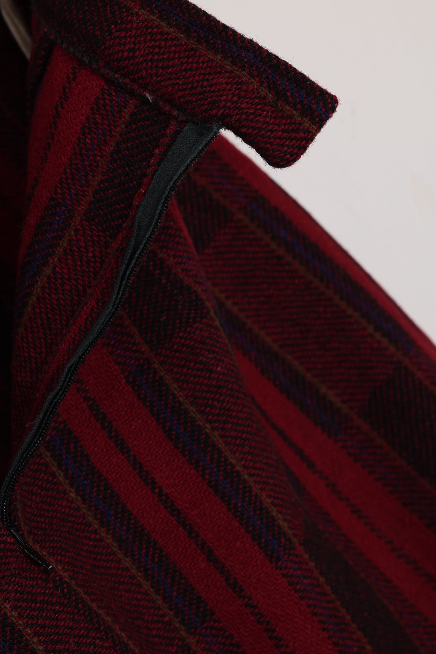 Circa 1975–1985, wool plaid day skirt, A-line structure, small-scale manufacture