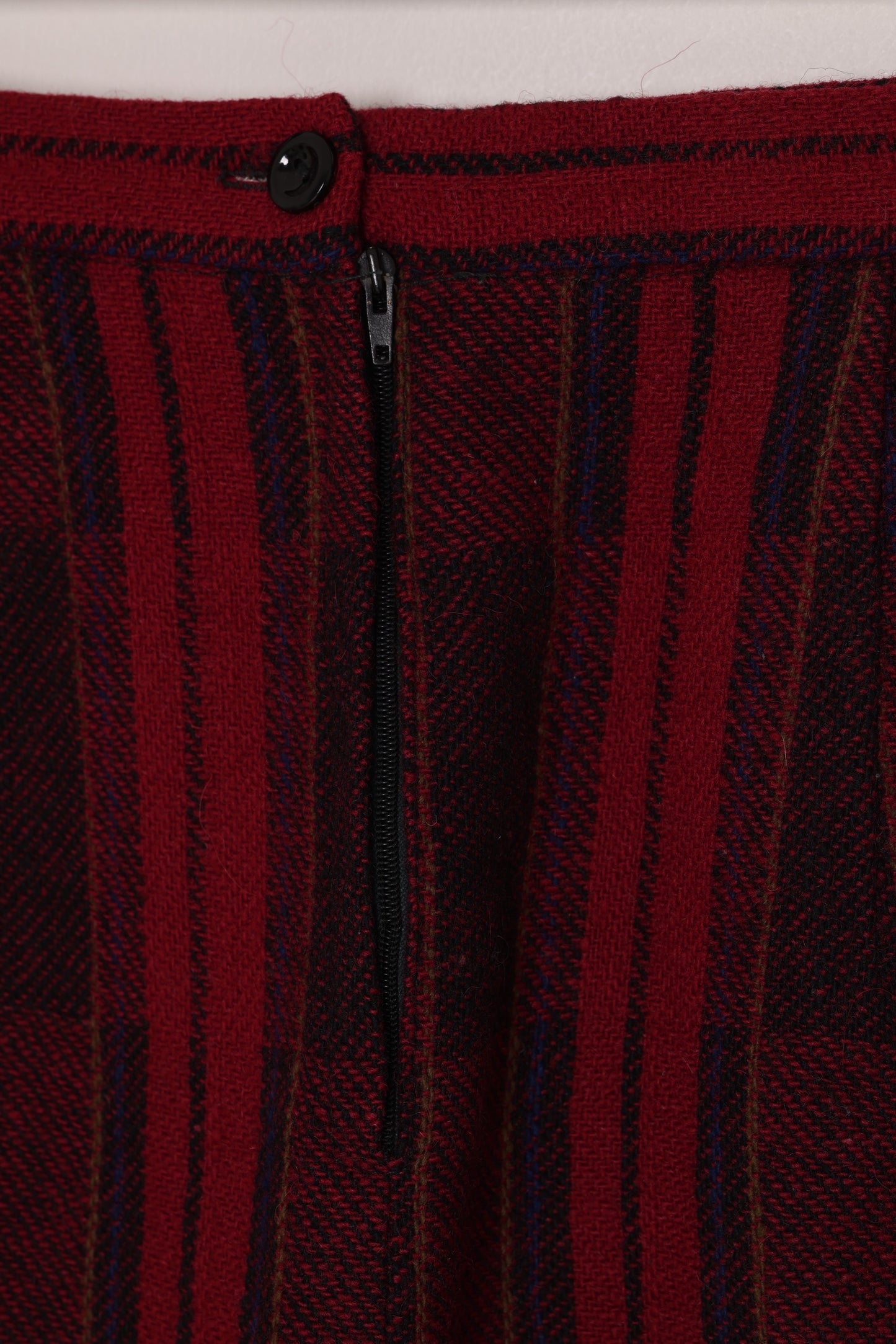Circa 1975–1985, wool plaid day skirt, A-line structure, small-scale manufacture