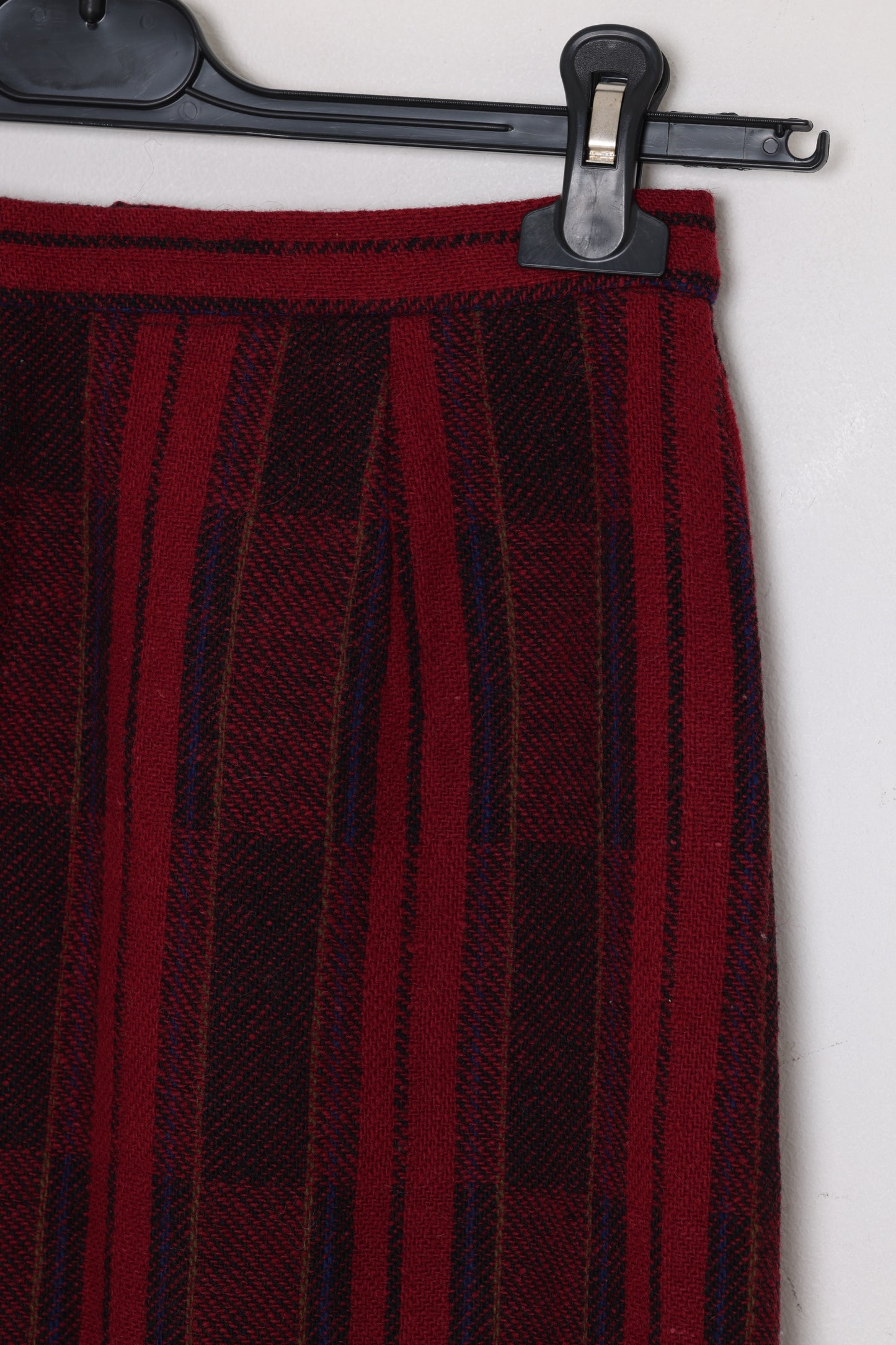 Circa 1975–1985, wool plaid day skirt, A-line structure, small-scale manufacture